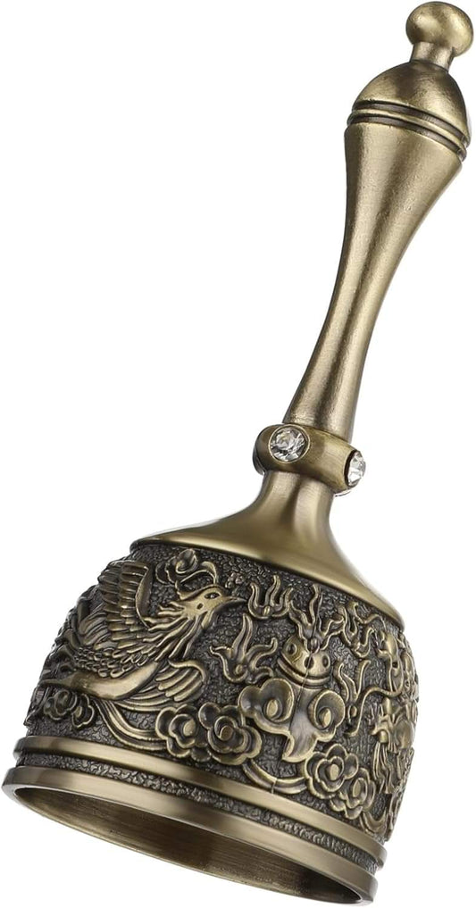Brass hand bell with ornate dragon and floral relief, round top handle