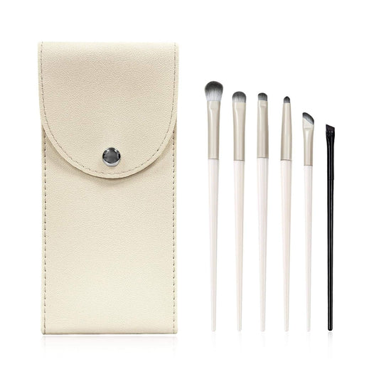 Beige snap-on brush case with six eye makeup brushes and white handles