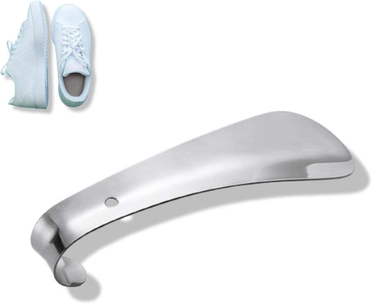 Stainless steel metal shoe horn with curved spoon tip, shown beside a sneaker