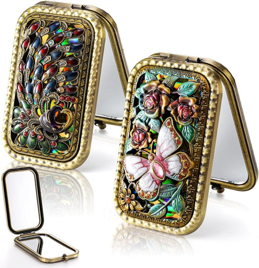 Folding vanity mirror with ornate gold-tone frame, double-sided butterfly and peacock design