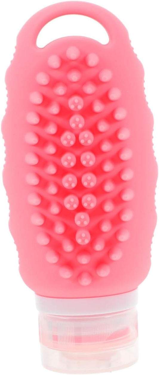 Pink silicone travel bottle with textured grip and clear flip-top cap