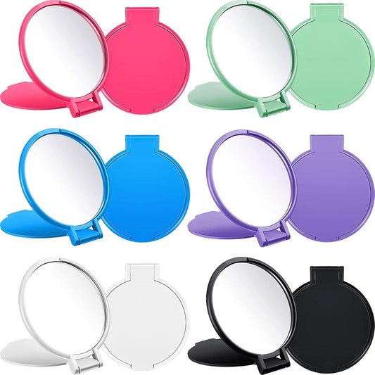 Round pink pocket compact mirror with hinged handle and glossy case