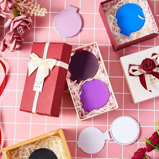 Round compact mirrors with ribboned gift boxes and colorful mirror cases