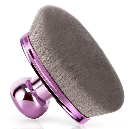 Body makeup brush with oval grey bristles and purple metallic handle, angled close-up.