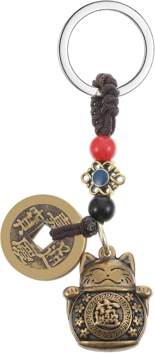 Lucky cat keychain charm with gold coins, black beads, red bead, and dark tassel