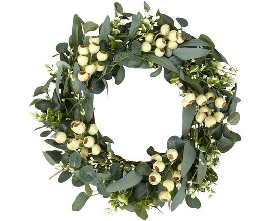 Green eucalyptus wreath with round beige seed pods and dark green leaves