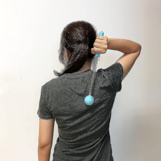 Blue massage stick pressed to upper back, showing spring and textured ball head