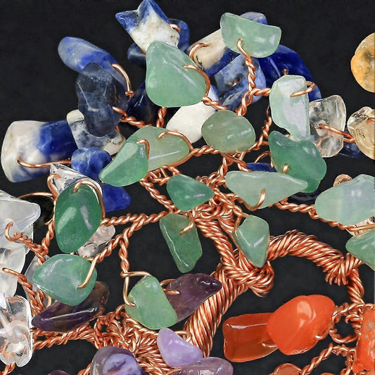Chakra crystal tree ornament close-up with copper wire and blue, green gemstone leaves