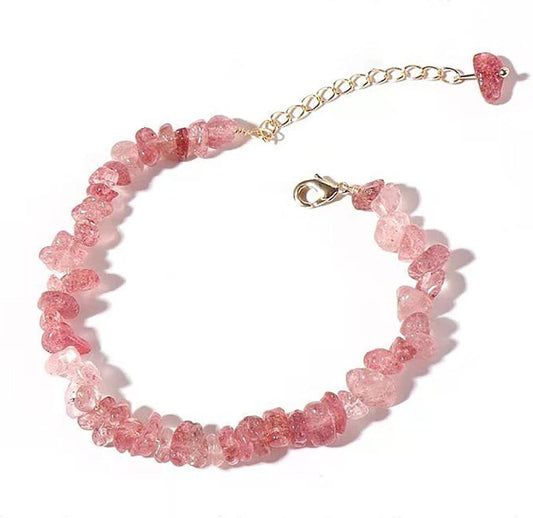 Pink crystal bead stretch bracelet with small heart charm and gold clasp