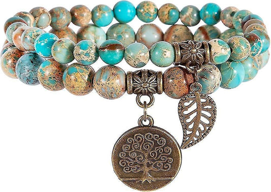 Turquoise and brown beaded chakra bracelet with round tree charm and wing dangle