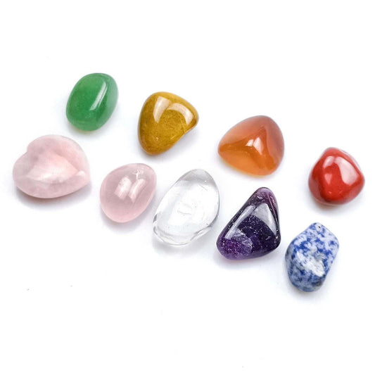 Seven chakra crystal stones set: polished hearts, teardrops, and triangles in assorted colors