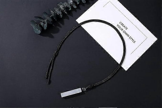 Black cord necklace with small silver bar pendant and adjustable sliding ends