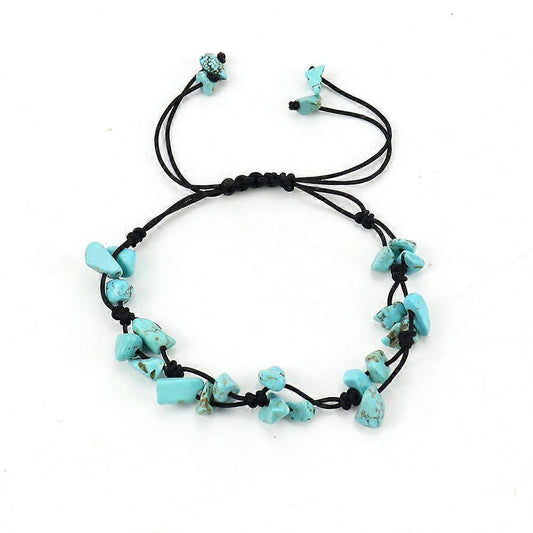 Turquoise gemstone bead bracelet with black cord and star-shaped charms