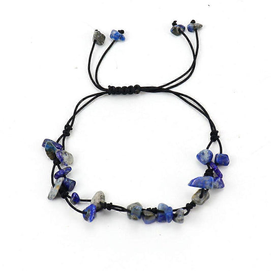 Handmade gemstone bracelet with black cord and blue, purple, gray stone beads