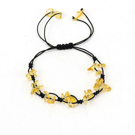 Beaded gemstone bracelet with black cord and yellow crystal chips, adjustable ties.