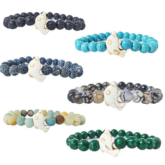 Set of gemstone bead bracelets in dark, teal, and gray with white crescent charms