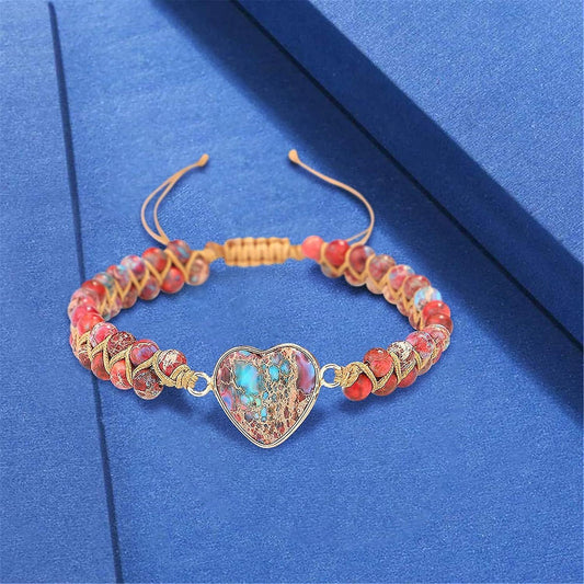 Heart charm beaded bracelet with turquoise centerpiece and gold-tone links