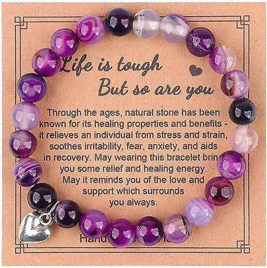 Purple stone bead bracelet with heart charm, on inspirational card
