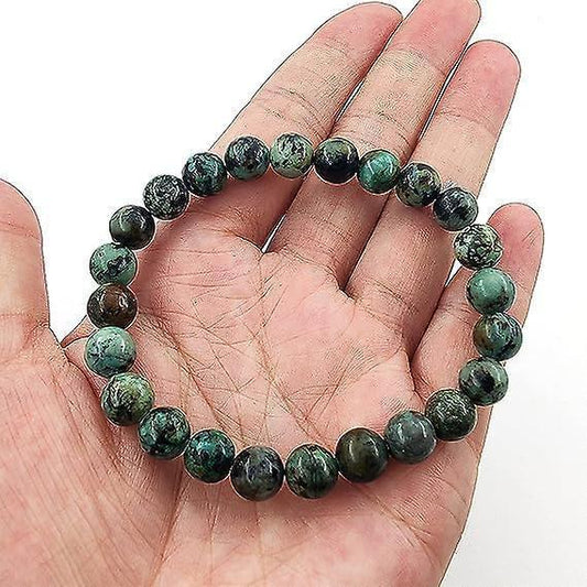 Natural stone bead stretch bracelet on hand, green and dark gray round beads