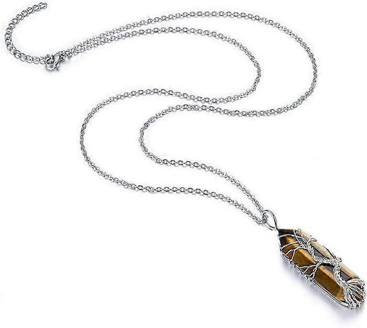 Silver chain necklace with wire-wrapped amber crystal point pendant on flat lay