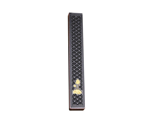 Black incense stick holder with ornate silver pattern and gold flower inlay strip