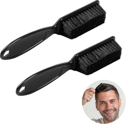Nylon cleaning brush with black handle and rectangular bristle head for clipper blades