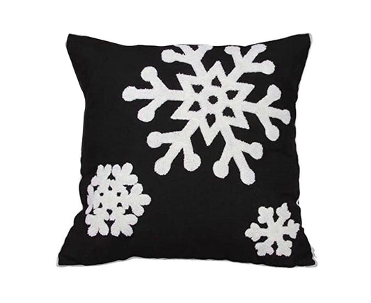Black throw pillow cover with three white snowflake designs, square shape