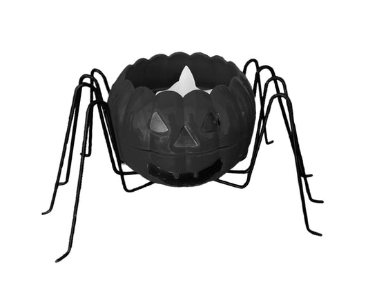 Black metal spider candle holder with scalloped bowl and arched legs