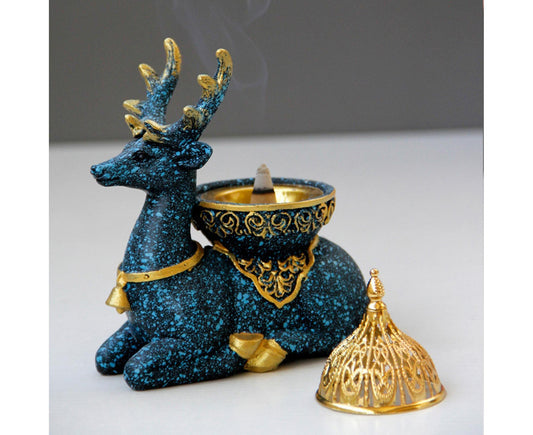 Dark blue reindeer incense holder with gold bowl and separate ornate gold lid
