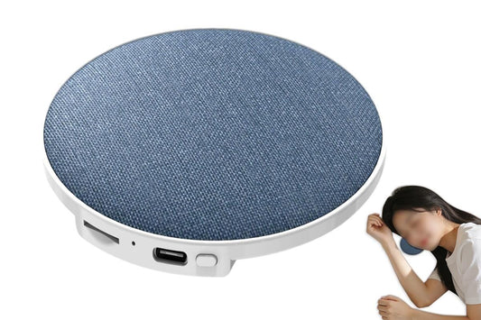 Round blue fabric wireless speaker puck with side ports and control buttons