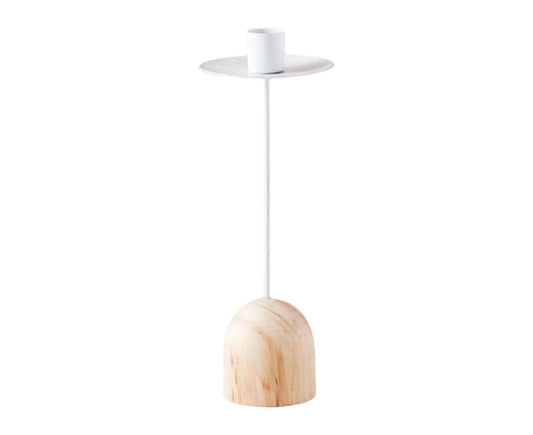 White metal candlestick with round plate top and light wood arched base