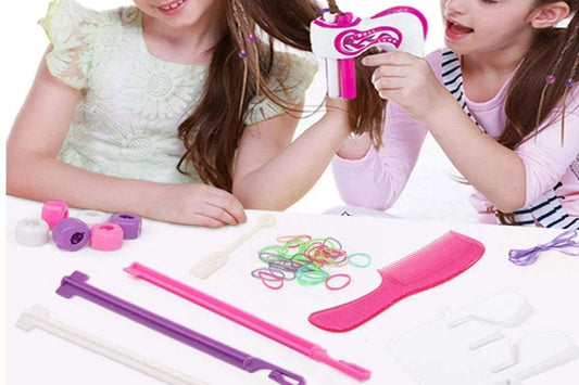 Electric hair braiding kit with pink rollers, comb, and colorful hair ties on table