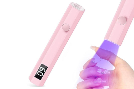 Pink handheld UV nail lamp with round power button and rectangular display