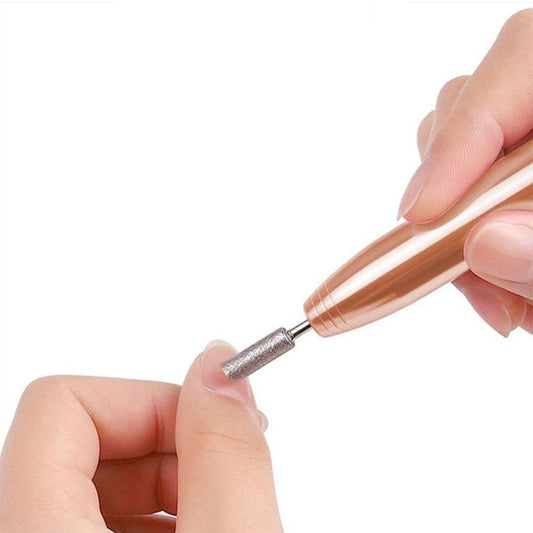 Hand holding rose wood nail drill bit with metal sanding head