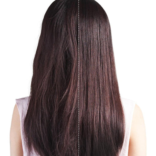 Straightened dark hair strands with center part, used with a hot brush straightener