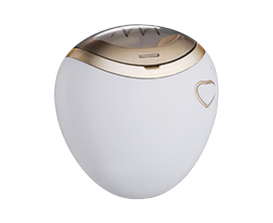 White electric fingernail clipper with gold-toned top and shield button