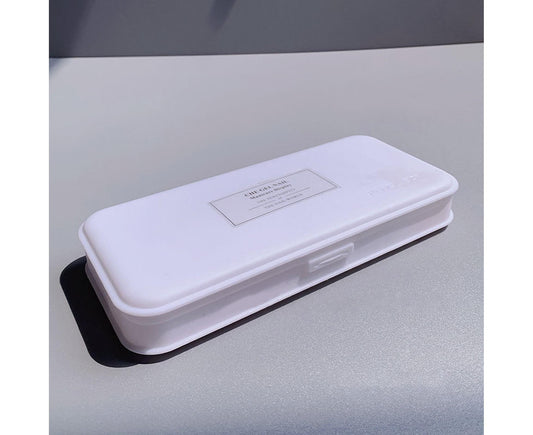 White plastic nail tools organizer box, side view