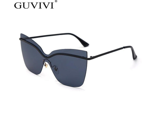 Dark navy cat-eye sunglasses with slim metal hinges and gradient lenses