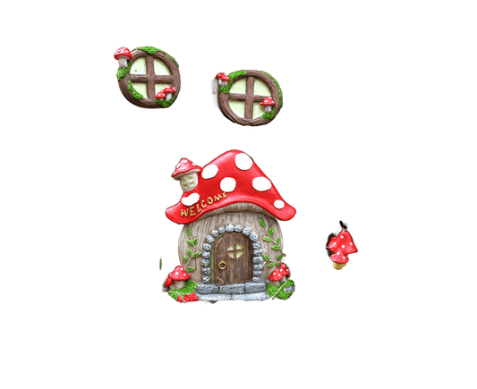 Luminous mushroom house garden ornament with red polka-dot roof and wooden door.