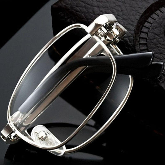 Silver foldable metal reading glasses with clear lenses and hinged frames