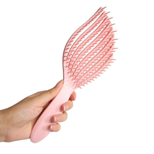Pink detangling hair brush with closely spaced flex pins and wide teeth