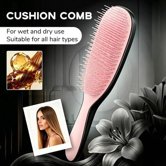 Pink silicone cushion massage comb with flexible bristles and curved handle