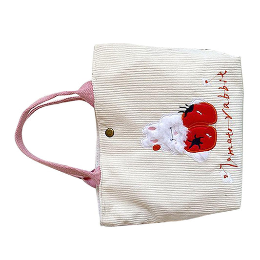 Small tote handbag with pink handles, white striped fabric, rabbit graphic on side