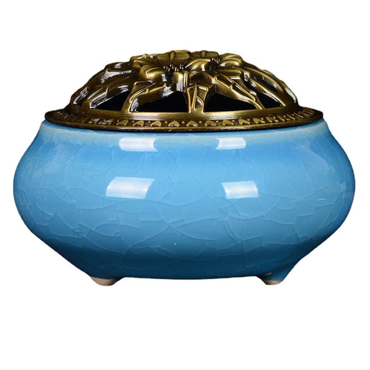 Sky blue ceramic incense burner with cracked glaze and ornate gold lid
