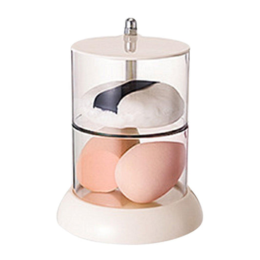 Two-tier rotating powder puff organizer with clear sides and white base, holding puffs