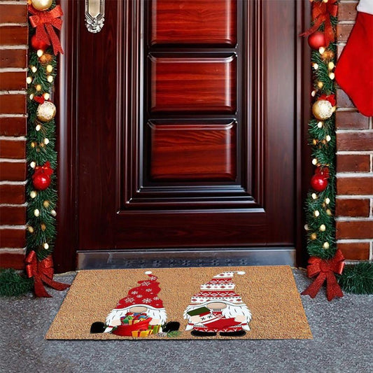 Christmas doormat showing two Santa-style gnomes holding gifts on tan surface
