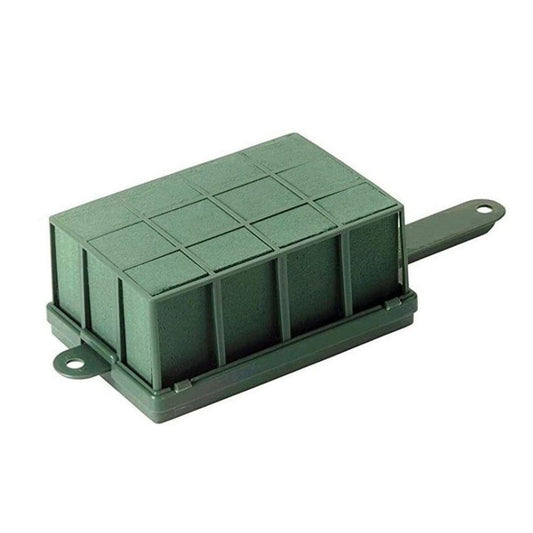 Green rectangular floral foam cage holder with handle, grid top for fresh flower arranging