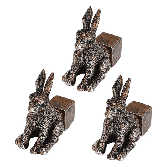 Set of rabbit flowerpot feet, dark resin figures with square raised bases