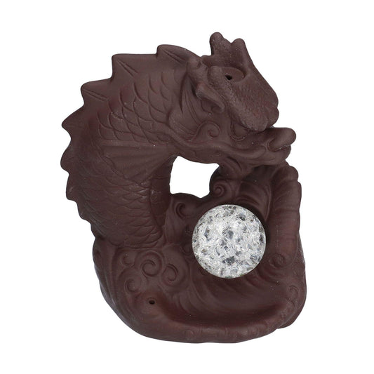 Dragon-shaped ceramic incense burner in dark brown with a circular glowing chamber