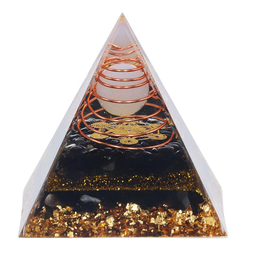 Decorative pyramid ornament with black resin and gold glitter, copper coil symbols inside